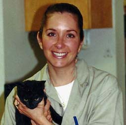 Georgetown Animal Clinic - staff member holding a black cat