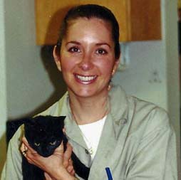 Georgetown Animal Clinic - staff member holding a black cat Georgetown Animal Clinic - staff member holding a black cat